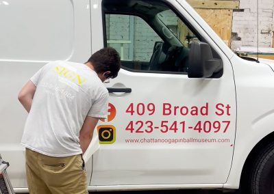 Visual Impression Sign Solutions wrapping a vehicle in Chattanooga TN